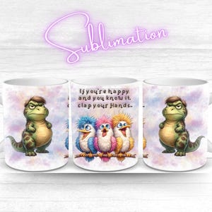May include: White ceramic mug featuring a cartoon dinosaur and three colorful birds. The mug has the text "If you're happy and you know it, clap your hands." The dinosaur is green with brown spots.