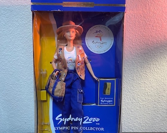 Mattel Sydney 2000 Olympic Pin Collector Barbie doll, collector edition, featuring a tan pin collector vest.See photos