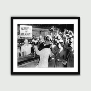 May include: Black and white photo of a group of people celebrating the repeal of the 18th Amendment, also known as Prohibition. A sign reads "Farewell 18th Amendment".