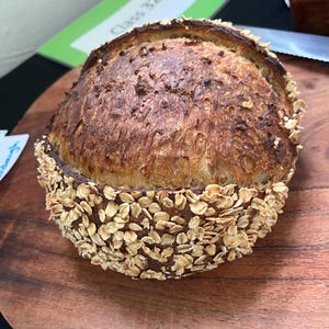 honey and oat sourdough, with center score, and oat crust.