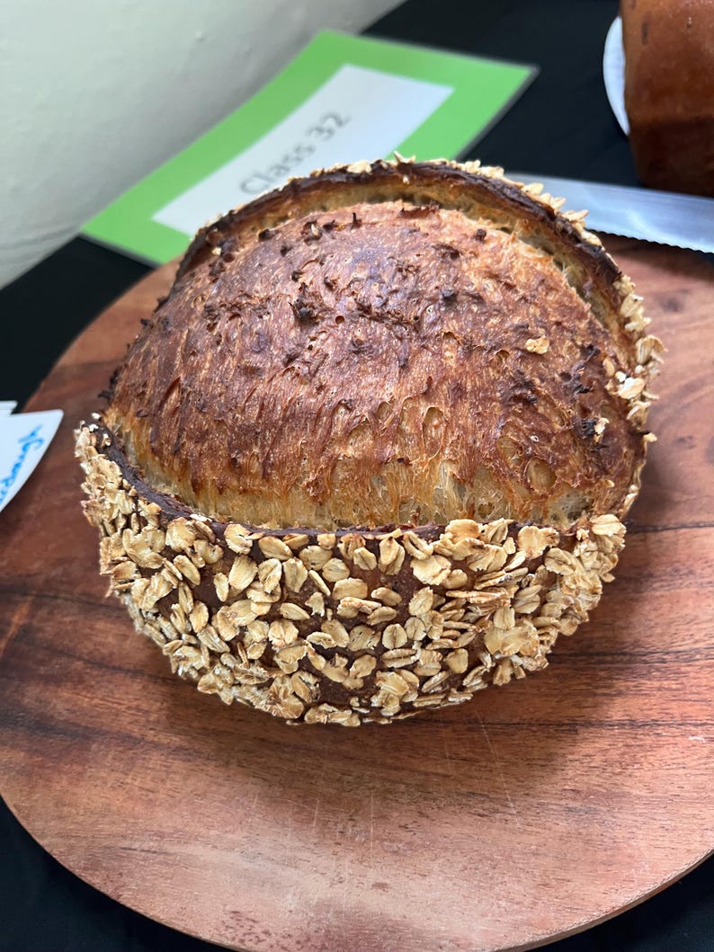 honey and oat sourdough, with center score, and oat crust.