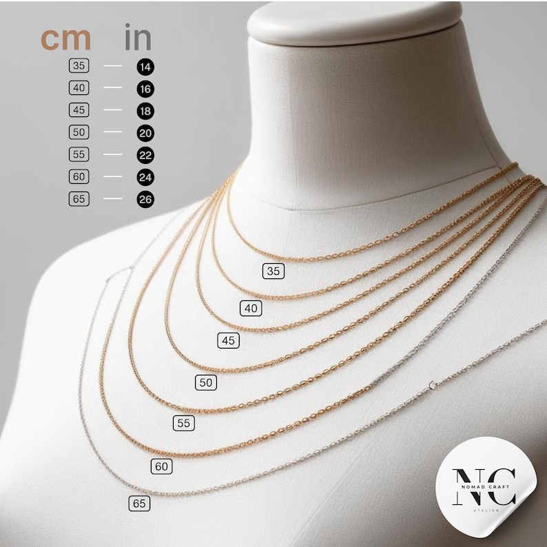 a white mannequin with a number of necklaces on it