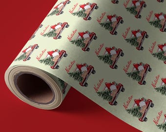 May include: A roll of green wrapping paper with a repeating pattern of red trucks carrying Christmas trees and the name "Natalie" printed on each truck.