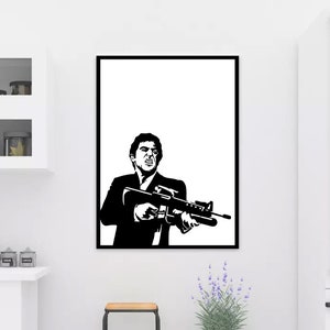 May include: Black and white framed wall art featuring a stylized image of a man holding a machine gun. The artwork is a graphic illustration with bold lines and a minimalist aesthetic. The man is wearing a suit and tie.