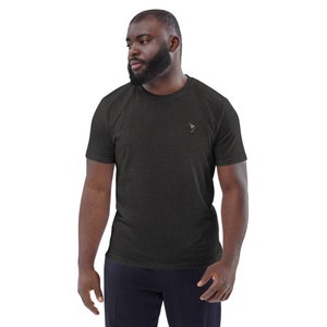 May include: A dark heather grey t-shirt with a small embroidered design on the left chest.