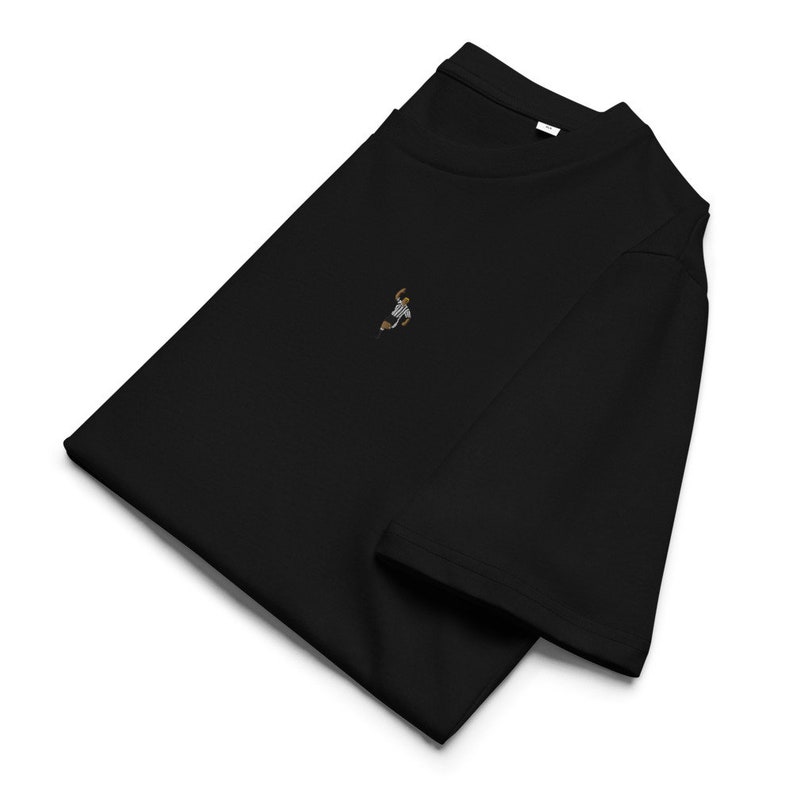 May include: Black t-shirt with a small embroidered image of a person playing basketball.