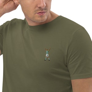 May include: A green t-shirt with an embroidered image of a soccer player celebrating a goal.