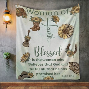 May include: A light blue and green tapestry with a floral design and the text "Woman of Faith Blessed is the woman who Believes that God will fulfill all that he has promised her Luke 1:45".