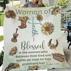 May include: A green and white throw blanket with a floral design and the text "Woman of Faith Blessed is the woman who Believes that God will fulfill all that he has promised her Luke 1:45".