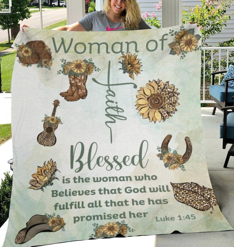May include: A green and white throw blanket with a floral design and the text "Woman of Faith Blessed is the woman who Believes that God will fulfill all that he has promised her Luke 1:45".