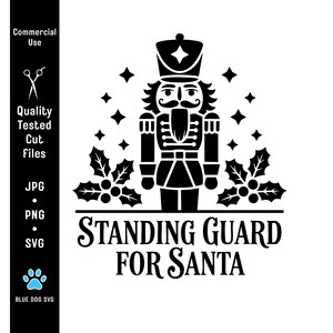 May include: Black and white graphic of a nutcracker soldier with the text "STANDING GUARD FOR SANTA". The design includes holly leaves and star shapes, suitable for Christmas-themed crafts and decorations.