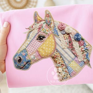 May include: A pink fabric featuring a patchwork horse head. The horse's head is crafted from diverse floral and patterned fabrics, adorned with lace and miniature flower embellishments. The horse's eye is detailed, set against a pink backdrop.