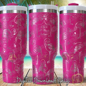 May include: A pink stainless steel tumbler with a silver flamingo design. The tumbler has a lid and a straw. The text "Life is all About Balance" is printed on the tumbler.
