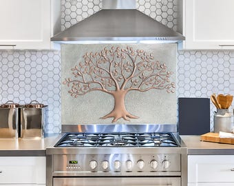 May include: A stainless steel stove with a copper tree design backsplash. The stove has five burners and a large oven.