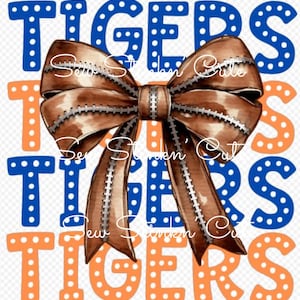 May include: Orange, blue and brown graphic with the word "TIGERS" repeated three times. A brown bow with white stitching is in the centre of the graphic.