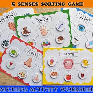 May include: A set of educational matching activity worksheets for children. The game includes cards labelled with the five senses: hearing, touch, sight, smell, and taste. Each card has related images, such as an ear for hearing and a nose for smell. The text "5 Senses Sorting Game" is at the top.