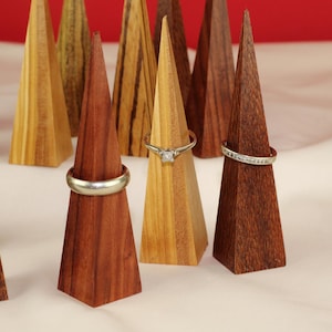 Modern Ring Display Stand Handmade Wood Construction Triangle Shape Design Premium Walnut Material Wedding Ring Display Vanity Accessory Minimalist Style Organizer Beautiful Geometric Pattern Clear Lacquer Finish Natural Wood Essential