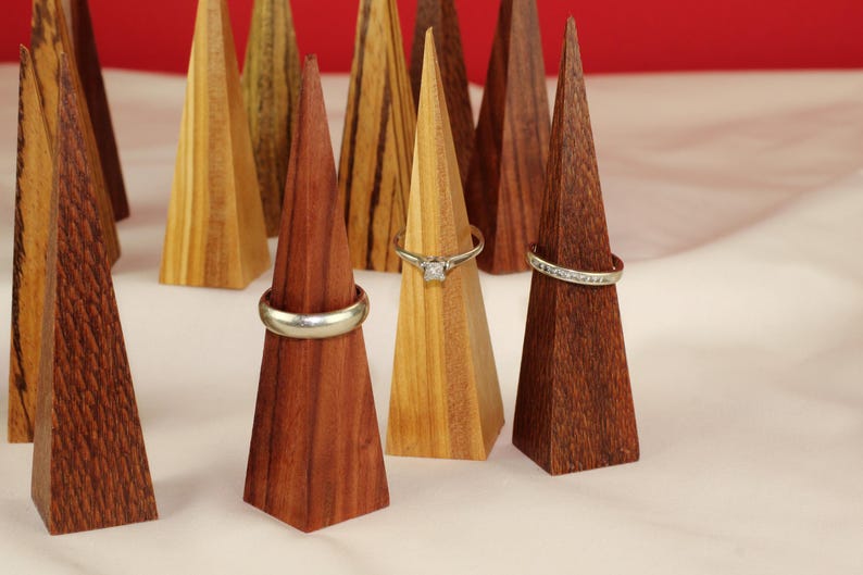 Modern Ring Display Stand Handmade Wood Construction Triangle Shape Design Premium Walnut Material Wedding Ring Display Vanity Accessory Minimalist Style Organizer Beautiful Geometric Pattern Clear Lacquer Finish Natural Wood Essential