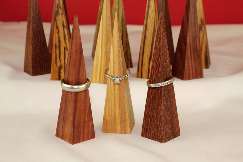 Modern Ring Display Stand Handmade Wood Construction Triangle Shape Design Premium Walnut Material Wedding Ring Display Vanity Accessory Minimalist Style Organizer Beautiful Geometric Pattern Clear Lacquer Finish Natural Wood Essential