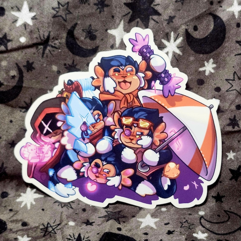 Puede incluir: Una pegatina con un grupo de personajes de dibujos animados con forma de mono. Los personajes tienen varios accesorios, como gafas, un paraguas y un bast&oacute;n. La pegatina tiene un borde blanco y est&aacute; sobre un fondo con motivos de estrellas y lunas.