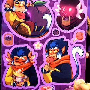 May include: A set of four stickers featuring a cartoon character with blue fur, a red scarf, and a yellow shirt. The character is shown in different poses, including holding a plum, a cup of tea, a lollipop, and a basket of plums. The stickers are on a purple background with the text "Plum Basket" at the top.