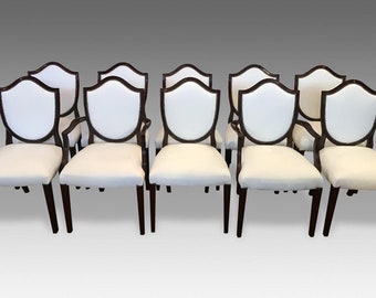 Stunningly beautiful exclusive Elite Shield Back style dining chairs professionally French polished and Upholstered.