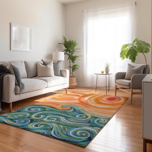 May include: A colourful rectangular rug with an abstract design. The rug depicts a sunset over ocean waves. The upper part has orange and yellow swirls, while the lower section shows blue and green waves. The rug is suitable for a living room.