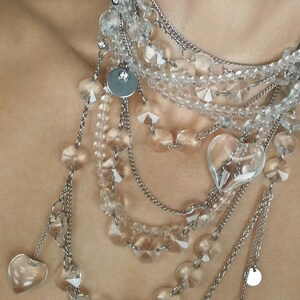 Stainless steel chain and layered quartz necklace featuring polished metal links and natural gemstone beads.
​