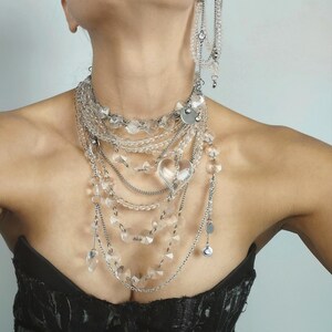 Clear quartz jewelry set featuring a necklace and earrings with faceted beads and durable steel chains.
​