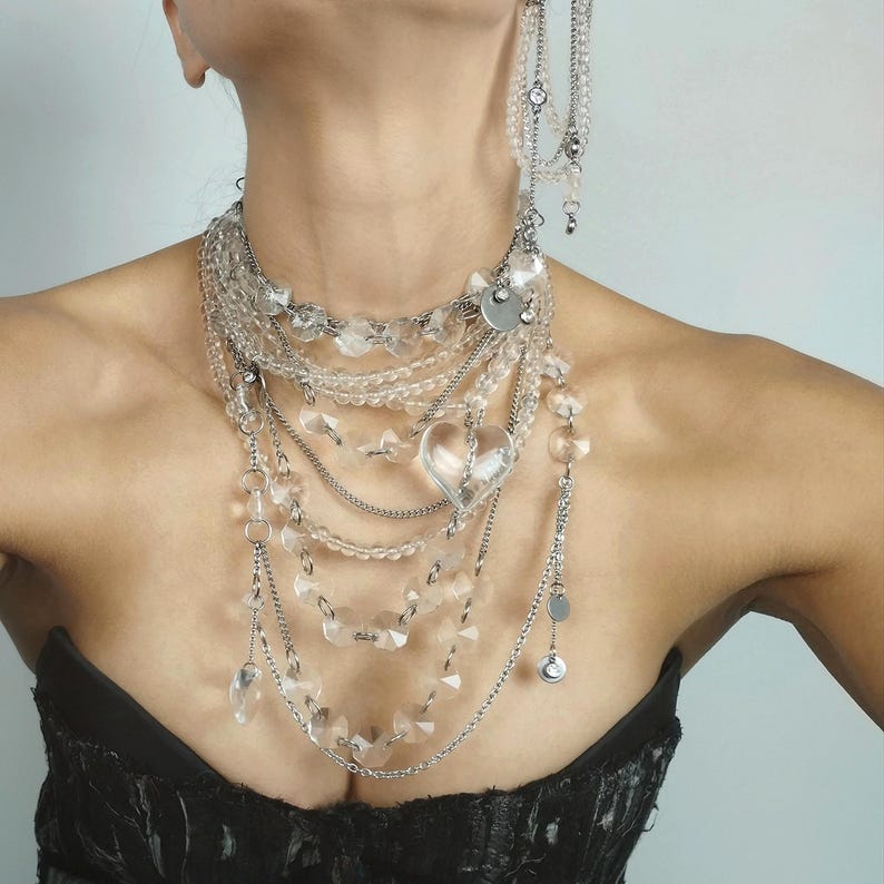 Clear quartz jewelry set featuring a necklace and earrings with faceted beads and durable steel chains.
​