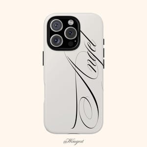 May include: A white smartphone case featuring a black camera module and the word Angel written in a large, elegant, flowing black cursive script that extends vertically across the back of the case surface.