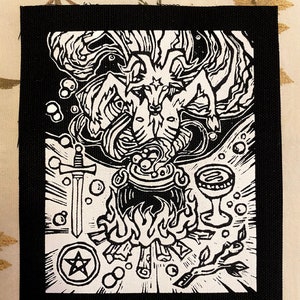 May include: Black and white embroidered patch featuring a stylized image of a goat-like figure with horns and a pentagram, surrounded by swirling smoke, a cauldron, a sword, a goblet, and flames.