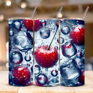May include: Three stainless steel tumblers with a design of red cherries and ice cubes floating in water. The cherries are surrounded by bubbles.