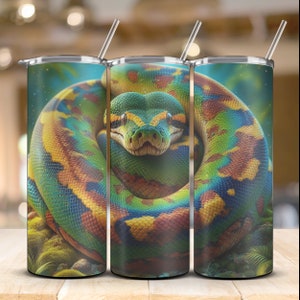 May include: Three stainless steel tumblers with a colorful snake design. The snake is green, yellow, and blue with a black background. The tumblers are perfect for keeping drinks cold or hot.