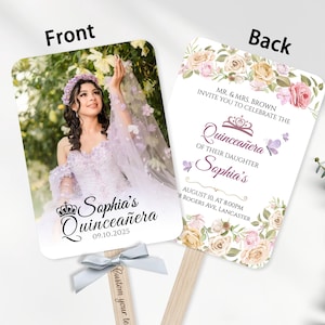 May include: A double-sided fan with a photograph of a young woman in a formal gown on the front. The back features floral designs and text that reads "Quincea&ntilde;era" and event details. A light blue ribbon is attached to the wooden handle.