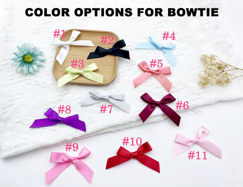 May include: An assortment of eleven satin bowties in various colors, including white, black, light blue, pink, purple, and red. The text "COLOR OPTIONS FOR BOWTIE" is at the top. Each bow is labeled with a number from 1 to 11.