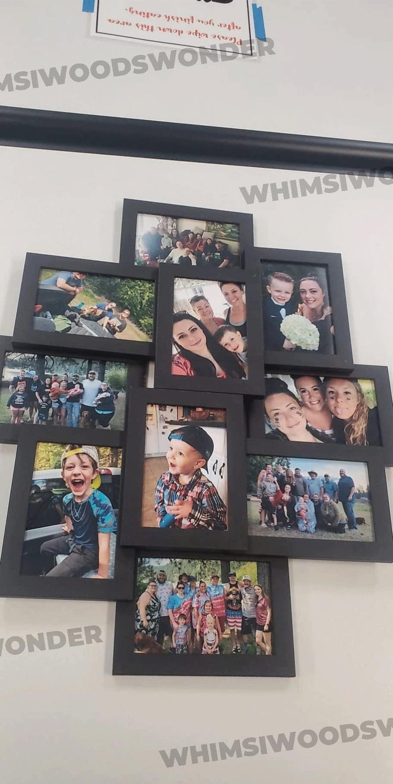 May include: A collage of black picture frames with various family photos. The frames are arranged in a geometric pattern on a white wall. The photos show a variety of people, including children, adults, and families.