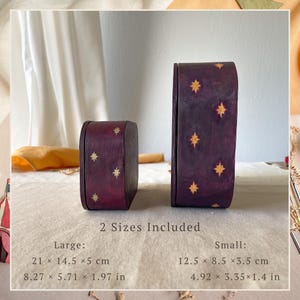 May include: Two dark purple wooden boxes with gold star patterns. The large box measures 8.27 x 5.71 x 1.97 inches, and the small box measures 4.92 x 3.35 x 1.4 inches. The text 2 Sizes Included is printed between the two boxes on the surface.