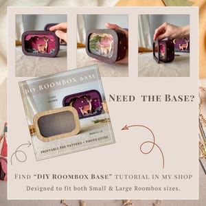 May include: A DIY roombox base kit featuring a dark brown rectangular frame with a magnetic lid. The kit includes a printable PDF pattern and photo guide for creating a miniature diorama with a deer scene. Text reads: DIY ROOMBOX BASE.
