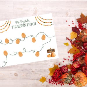 May include: A white sign with the text "Ms. Krystal's THUMBKIN PATCH" and a string of orange lights. The image is decorated with pumpkins, apples, and fall foliage. A small sign says "WELCOME" with pumpkins.