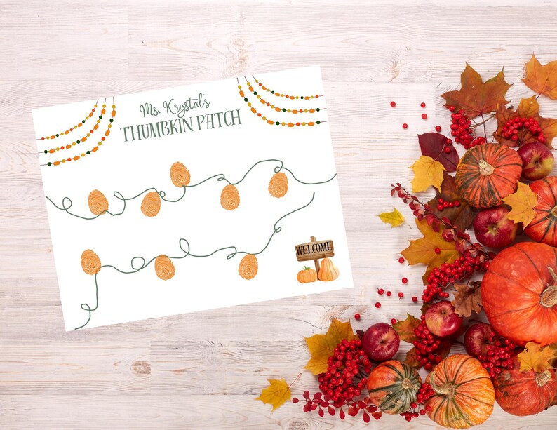 May include: A white sign with the text "Ms. Krystal's THUMBKIN PATCH" and a string of orange lights. The image is decorated with pumpkins, apples, and fall foliage. A small sign says "WELCOME" with pumpkins.
