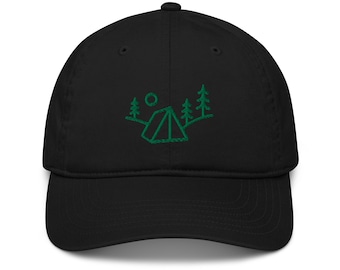 May include: A black baseball cap featuring an embroidered green line art design on the front. The graphic depicts a camping tent situated between two pine trees with a small circle representing the sun or moon positioned above the tent structure.
