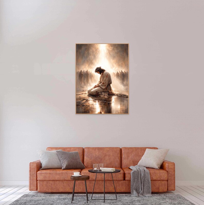May include: A framed art print depicts a figure kneeling in prayer, bathed in a radiant light. The artwork features a warm color palette with a soft, ethereal quality, suggesting a spiritual theme. A crowd of figures is in the background.