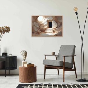 May include: A painting of a stone tomb with an open doorway. The tomb is set against a light brown background. The painting is framed in a light brown frame.