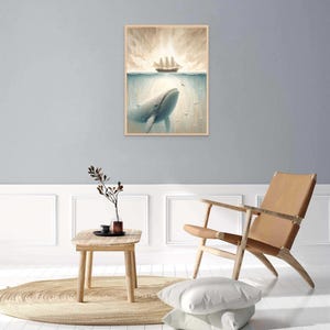 May include: A framed illustration of a whale swimming beneath the surface of the ocean, looking up at a ship sailing above the water. The sky is a light blue with white clouds.