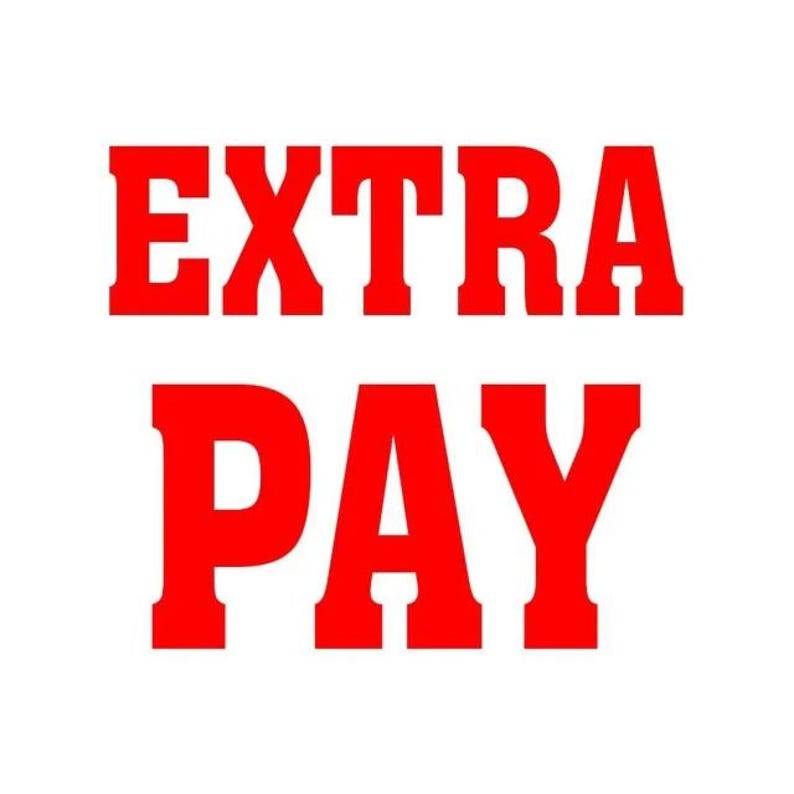 May include: Bold red text on a white background reads "EXTRA PAY". The words are stacked, with "EXTRA" above "PAY". The font is a thick, blocky style, making the text stand out.