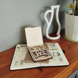 Escape sliding block puzzle. Brain teaser game with laser engaved and laser cut birch plywood blocks.