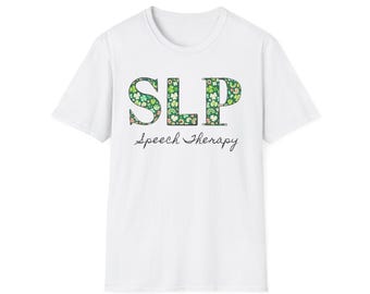 May include: White t-shirt with the letters "SLP" in a floral pattern, above the words "Speech Therapy" in a handwritten font. The shirt is a classic crew neck style.