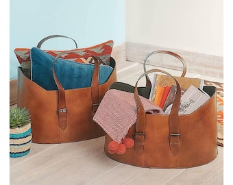 Cesta de leña ovalada de cuero: elegante y artesanal, ideal para guardar leña y decorar el hogar de forma rústica.