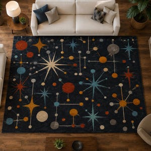 May include: A rectangular area rug featuring a dark navy blue background with a repeating pattern of mid-century modern starbursts, geometric lines, and circular shapes in shades of orange, light blue, yellow, and grey across the surface.